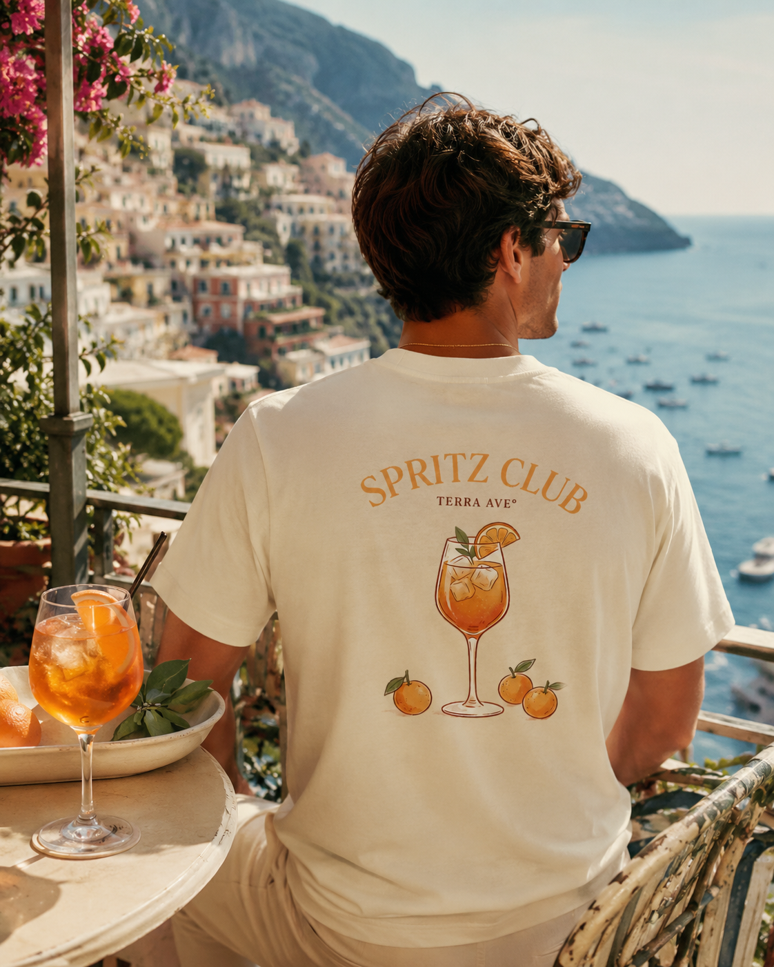 man in amalfi coast drinking aperol spritz with italy tshirt