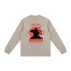 Beige long-sleeve shirt with a red and black graphic on the back against a white background