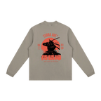 Beige long-sleeve shirt with red and black graphic on the back against a white background