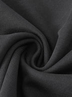 Oktoberfest oversized t-shirt black minimalist streetwear tee close up fabric